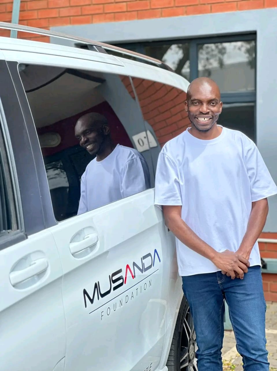Musanda with Car